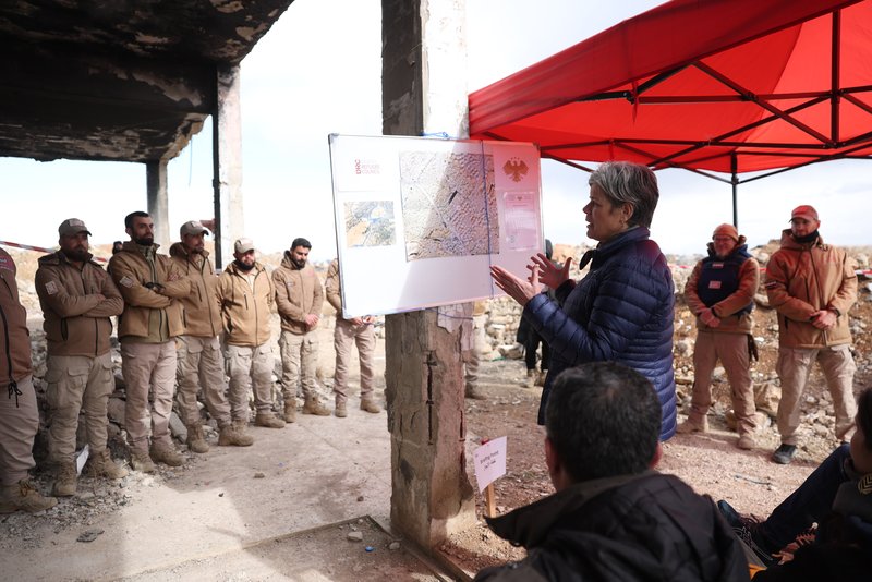 Charlotte Slente speaks to a newly graduated team of deminers. They are now ready to clear land contaminated by mines and unexploded ordnance..