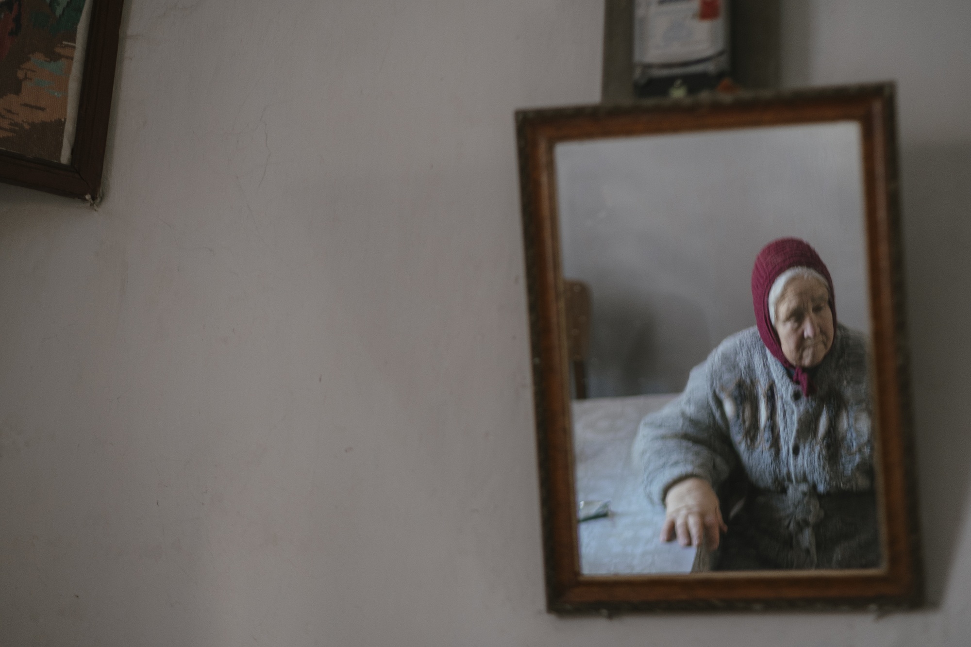Halyna, displaced from Enerhodar, misses her home and family — a home she cannot return to.©DRC Ukraine, Sumy Oblast, February 2026, Krystyna Pashkina.